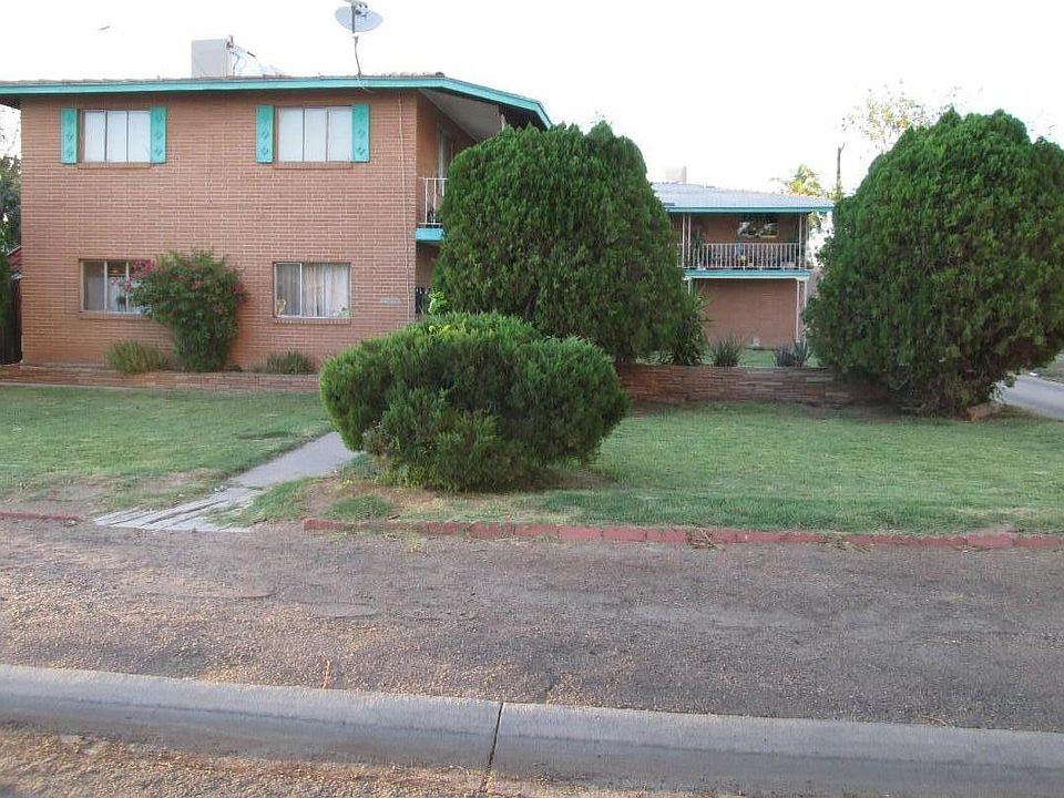 Covered parking and laundry in rear.