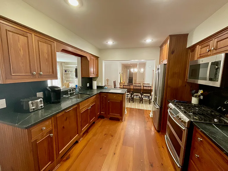 well stocked kitchen with new stainless appliances and gas cooking