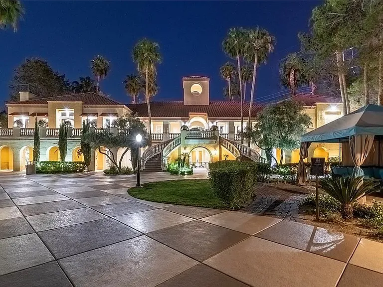View from the main pool area overlooking the clubhouse, featuring the 24/7 fitness center and multi-purpose space where community events and gatherings may be held.