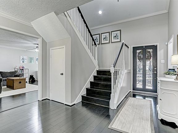 Welcoming foyer with a gorgeous front porch, leaded glass door and two story entry.
