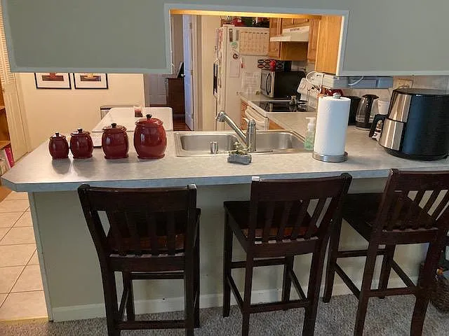 bar between family room and kitchen