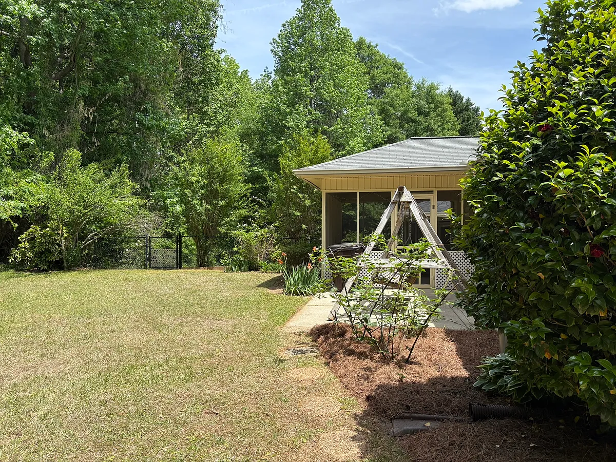 The property borders a wooded area in the back yard. - Douglas Manor Ct