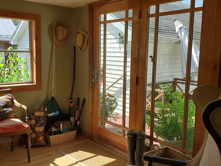 The three season sun room leads to a deck
