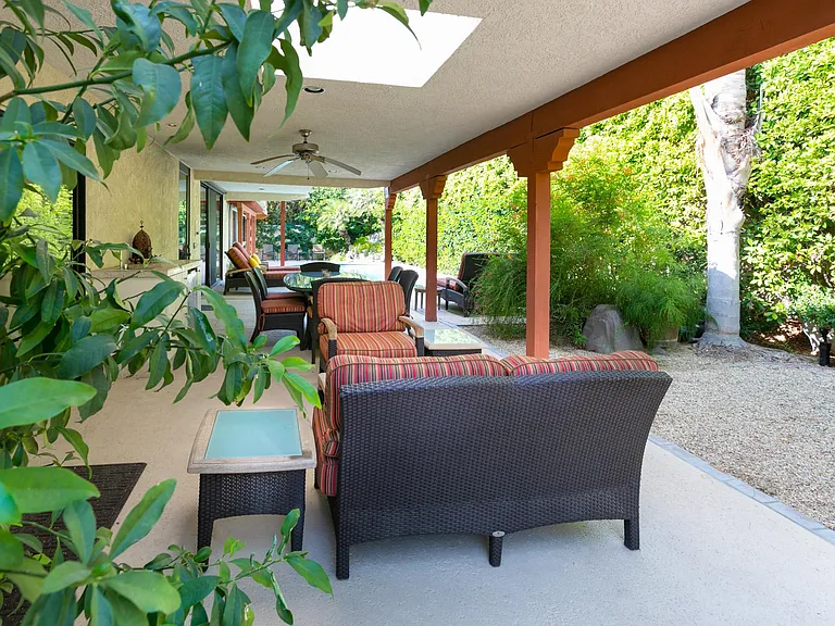 Outdoor conversation area near outdoor dining area.