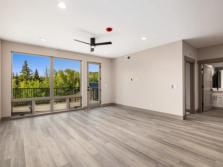 Great Room: Living Area, Wall-to-Wall Picture Window- Balcony
