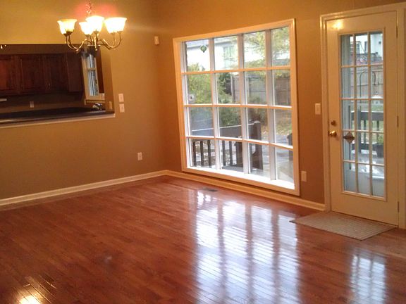 Casual dining area with custom bay window and pass-thru to kitchen.