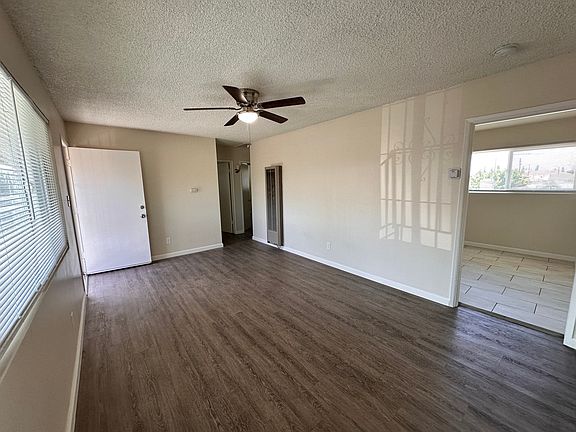 Living room, kitchen entrance on the right