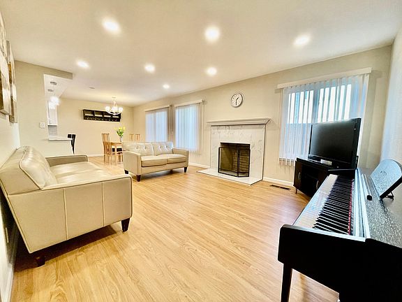 Living room - sofa, loveseat, and TV set can be included