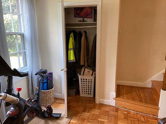 Good storage is afforded in this living room coat closet.