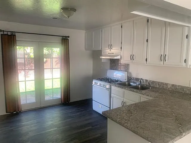 kitchen with french doors to access back yard