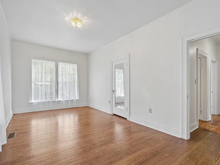 Door right opens to hallway, restroom and bedroom 2. Mirror door closet