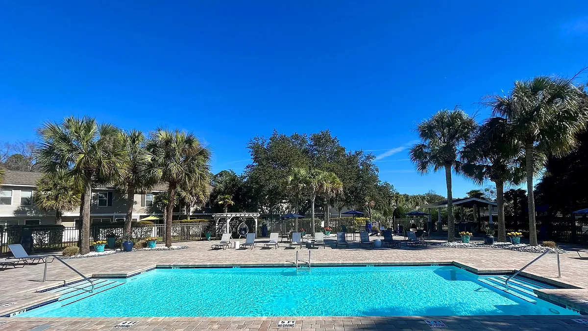 Immerse in the joy of our resort-style pool and expansive sundecka sunlit tropical paradise. - Lanier Landing