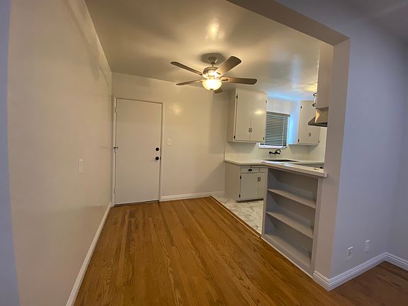Dining area adjacent to kitchen with back door entry