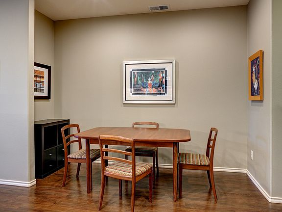 Dining area with hardwoods.