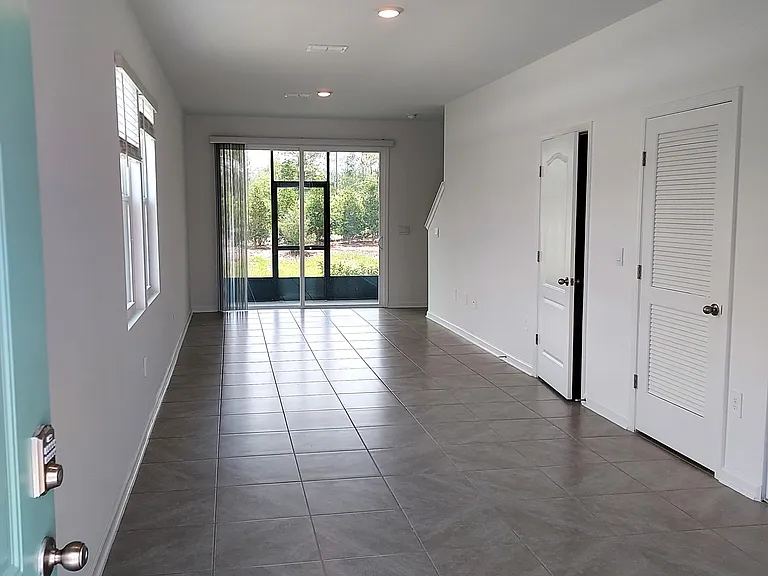 Entryway, dining area, and living area - tile floor