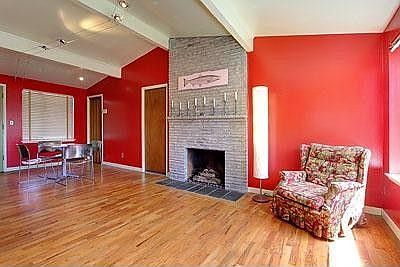 High ceilings, beams and original hardwoods make this 1955 mid-century modern home spacious and airy