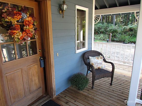 Wrap around deck on the front and side of the home.>