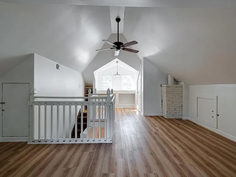 Lofted bedroom complete with closet. Awesome utility area for guest bed and home office.