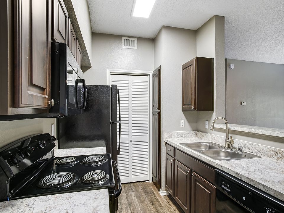 Model kitchen with custom cabinets and upgraded counter-tops