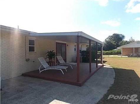 Covered back porch. Great place to enjoy your morning coffee!