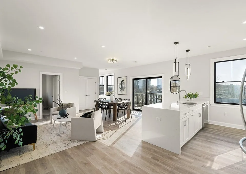 View of living + kitchen from front door