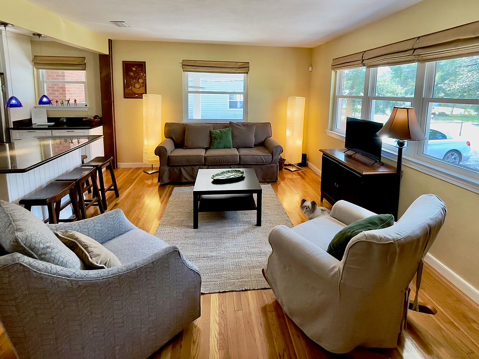 Open floor plan with living room, kitchen and separate but open dining room.