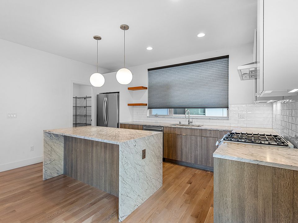 Chef's kitchen. Marble counters + Gas range.
