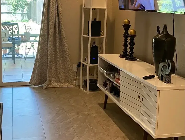 75" tv and cabinet in living area