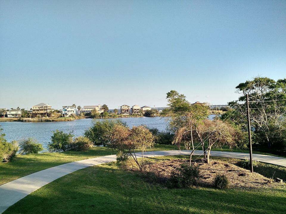 View of lagoon and Galveston Bay from front porch.
