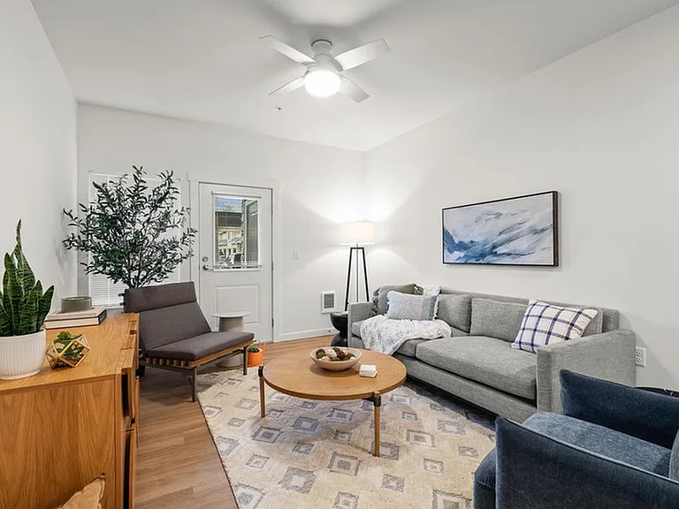 Elevate your lifestyle in this sophisticated living room, seamlessly blending comfort and modern design.