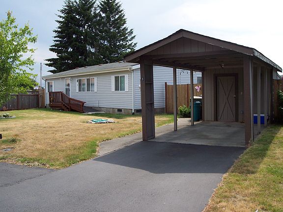 carport with plently of storage behind