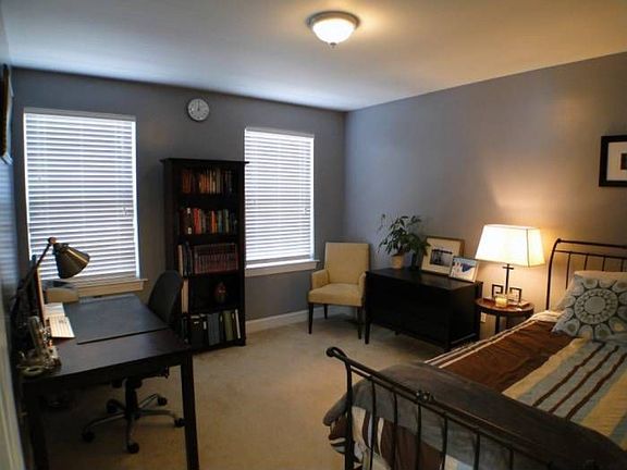 3rd bedroom or office with windows and closet