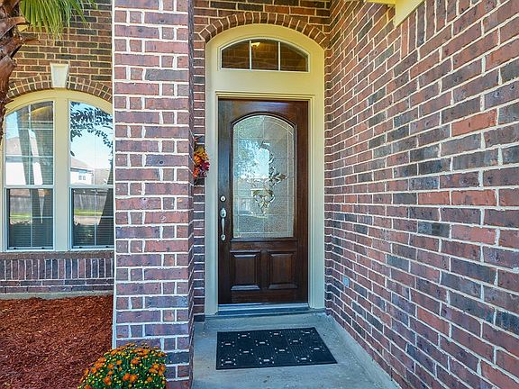 Newly refinished front door from which to welcome your visiting friends and family!
