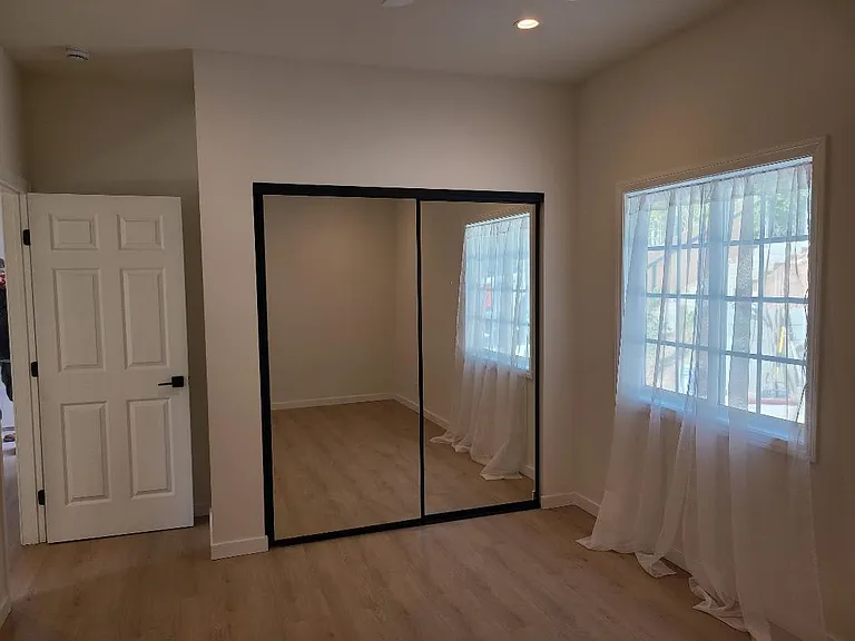 Bedroom 1 - Blackout shades being installed.