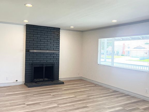 Main entry, front living room, light and bright, centerpiece fireplace
