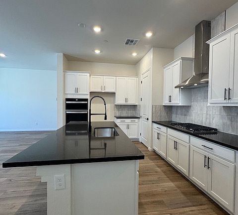 Brand New refrigerator and pendant lighting being installed