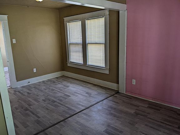 Extra large bedroom with a large closet and exterior french doors.