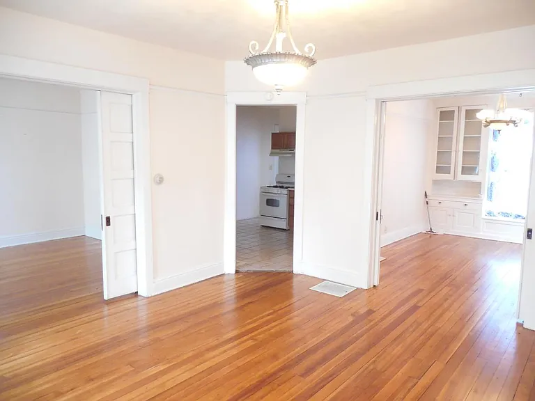 Living room looking to Den Dining room And Kitchen