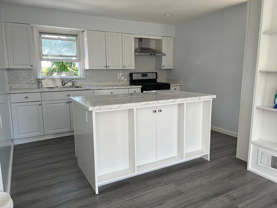 Kitchen: new backsplash, new countertop, new microwave, new island