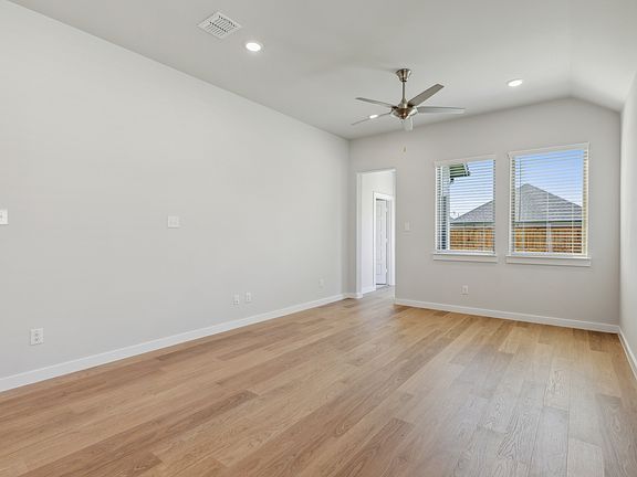 Living Room in the Cedar home plan by Trophy Signature Homes - REPRESENTATIVE PHOTO
