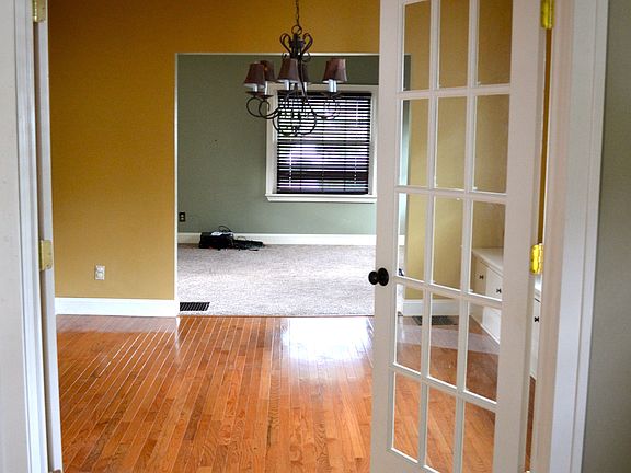 french doors lead into dinin