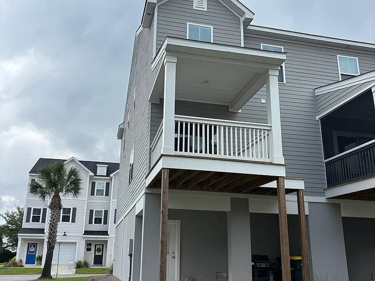 Back of house with patio