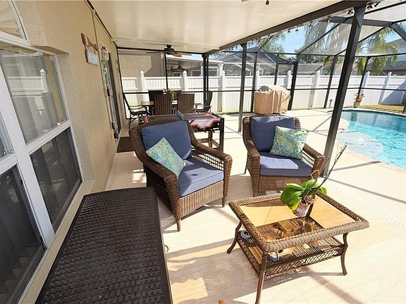 The covered lanai runs the full width of the home.