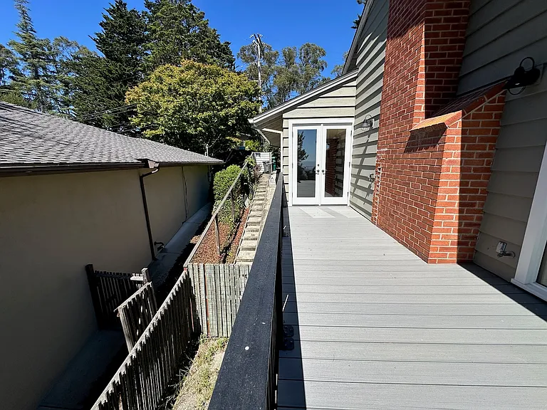 French door that leads to kitchen. Dog run on outside left.