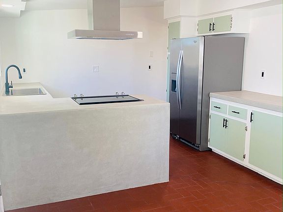 Converse with Guests while cooking, open concept dining area and kitchen