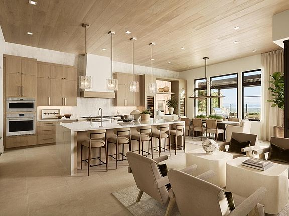 A photo of the Kitchen and Grand Dining Room in the Aliento model residence at Vista in Orchard Hill