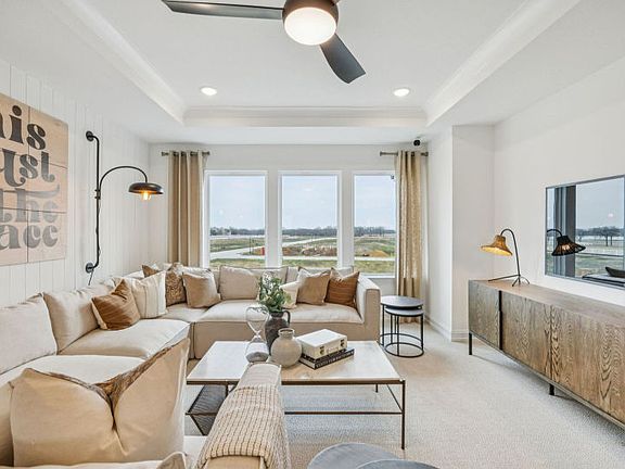 Spacious main living area with large windows