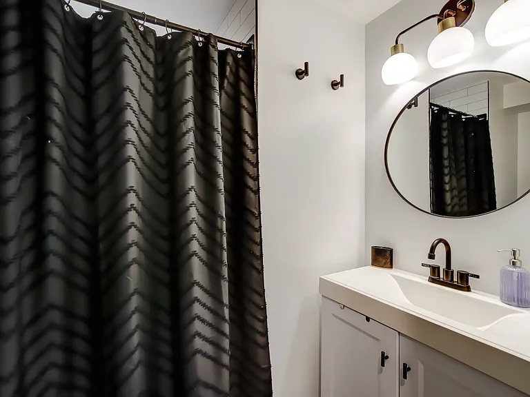 Bright, well-designed lighting ensures the bathroom feels fresh and inviting at any time of day.
