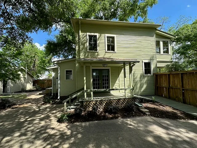 The dining room porch on the south side. A ramp at this porch provides wheelchair access to the house. - 1023 Tulane St