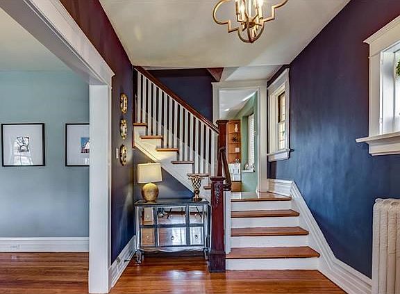 Entrance foyer greets guests with attractive open t-staircase